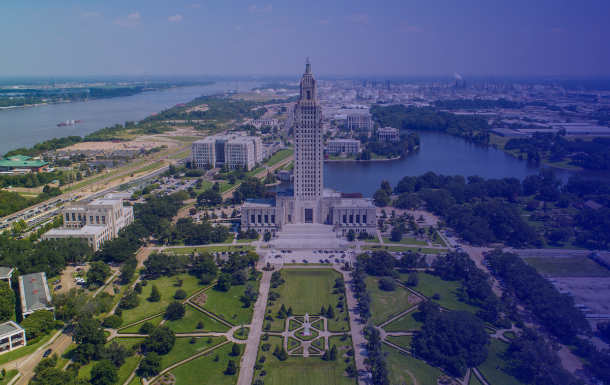 Aerial view of Baton Rouge showcasing the cityscape and the Louisiana State Capitol building, emphasizing the city's growth and development.